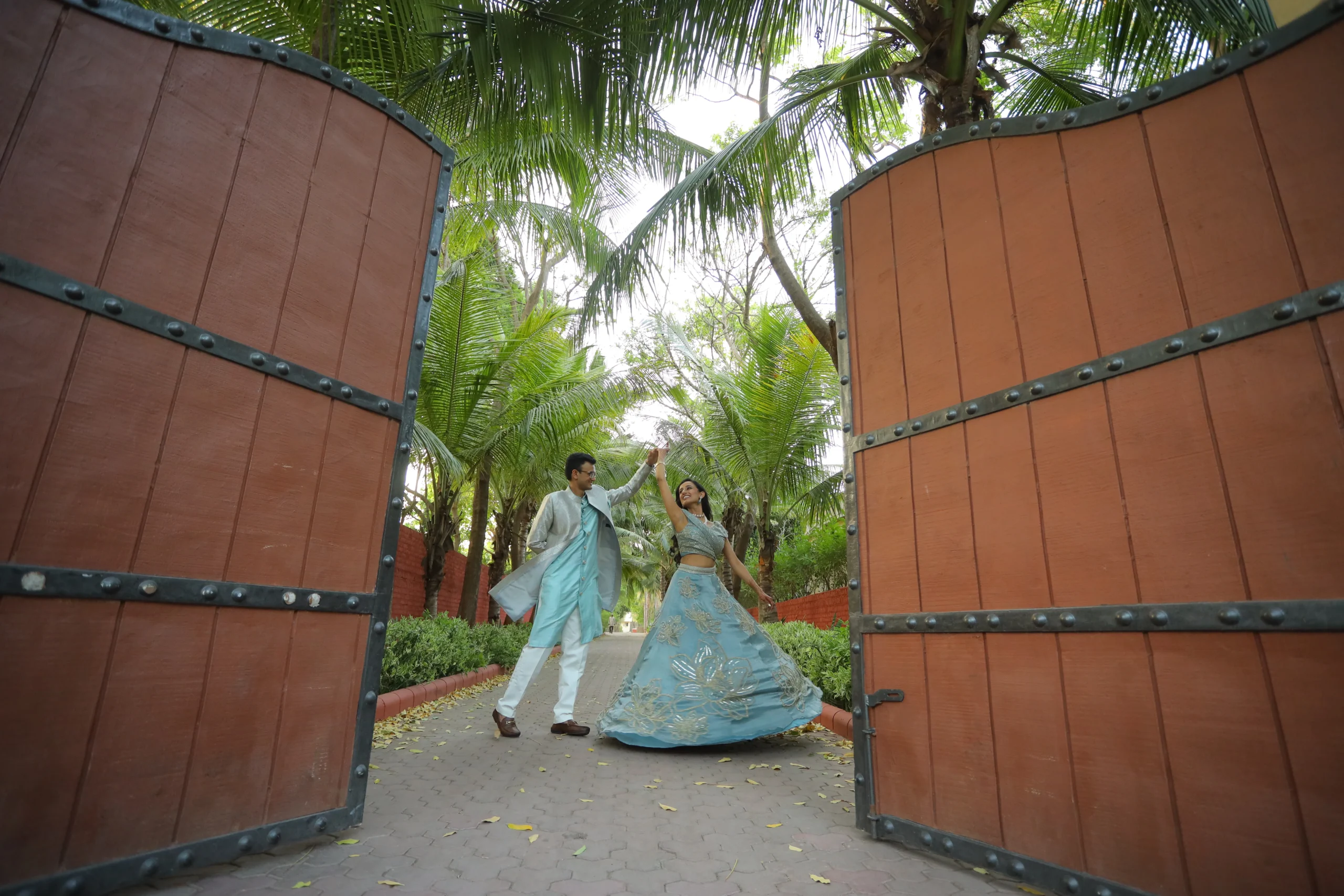 Bride and groom candid moment captured by Sahajanand Studio, best wedding photographer near me Rajkot. Couple Pose